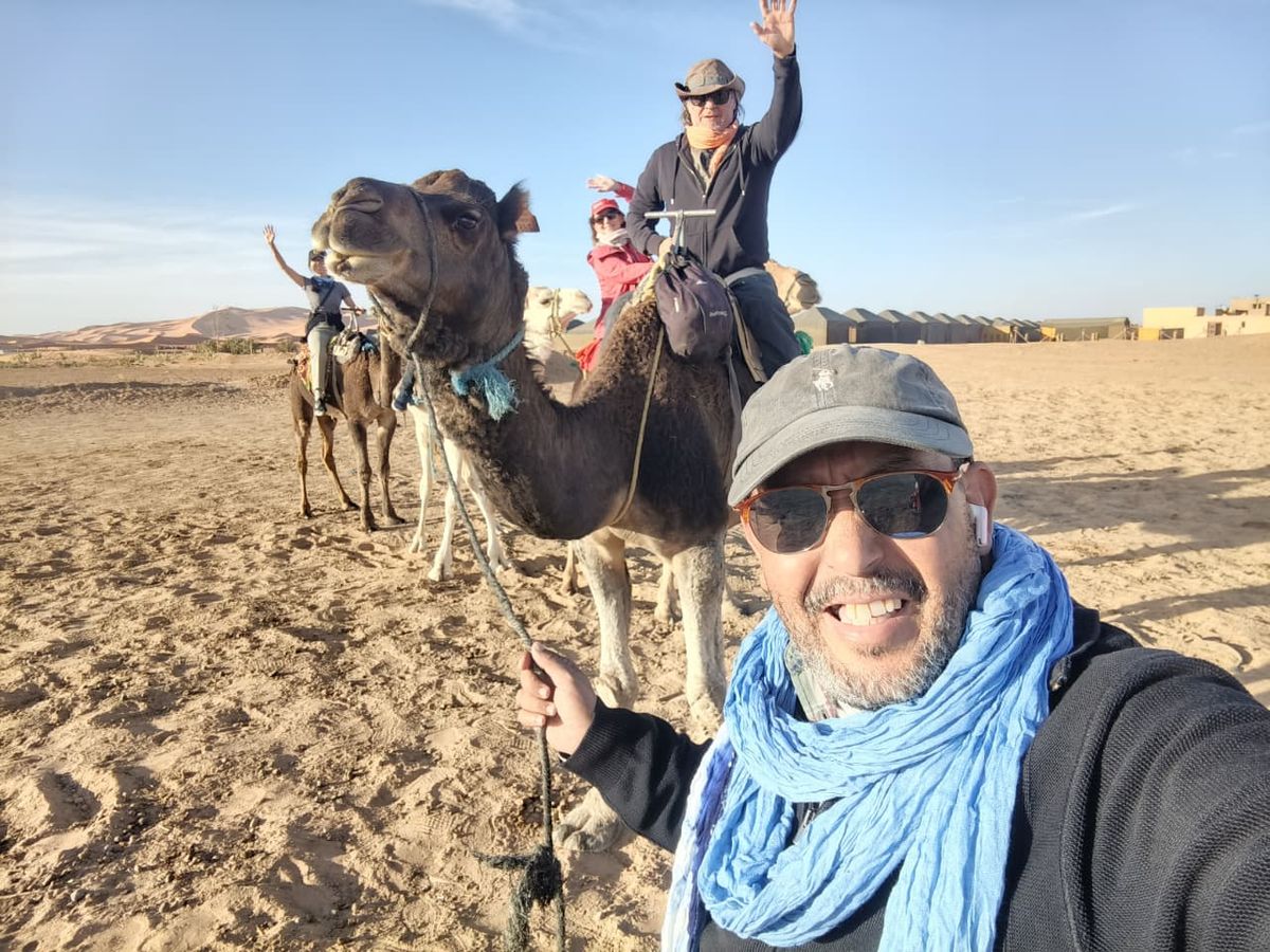 Camel trek arriving at the desert camp with our guide