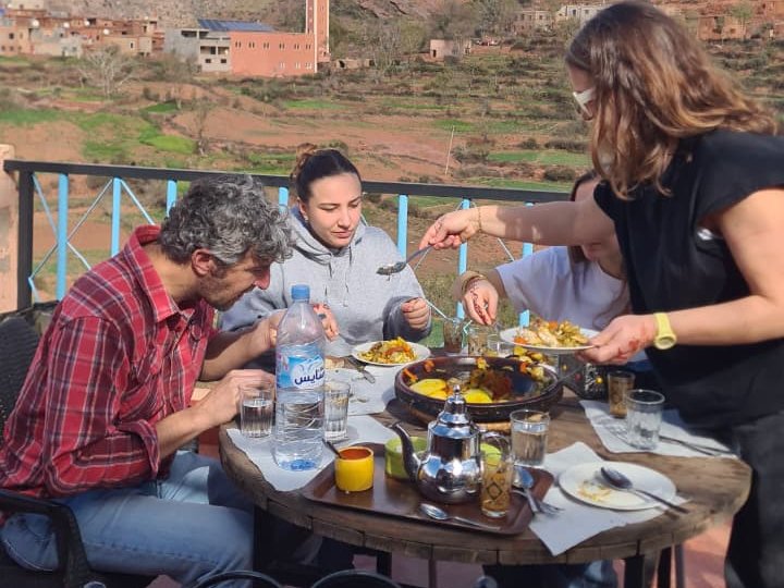 Sharing a tagine lunch with a view of the High Atlas